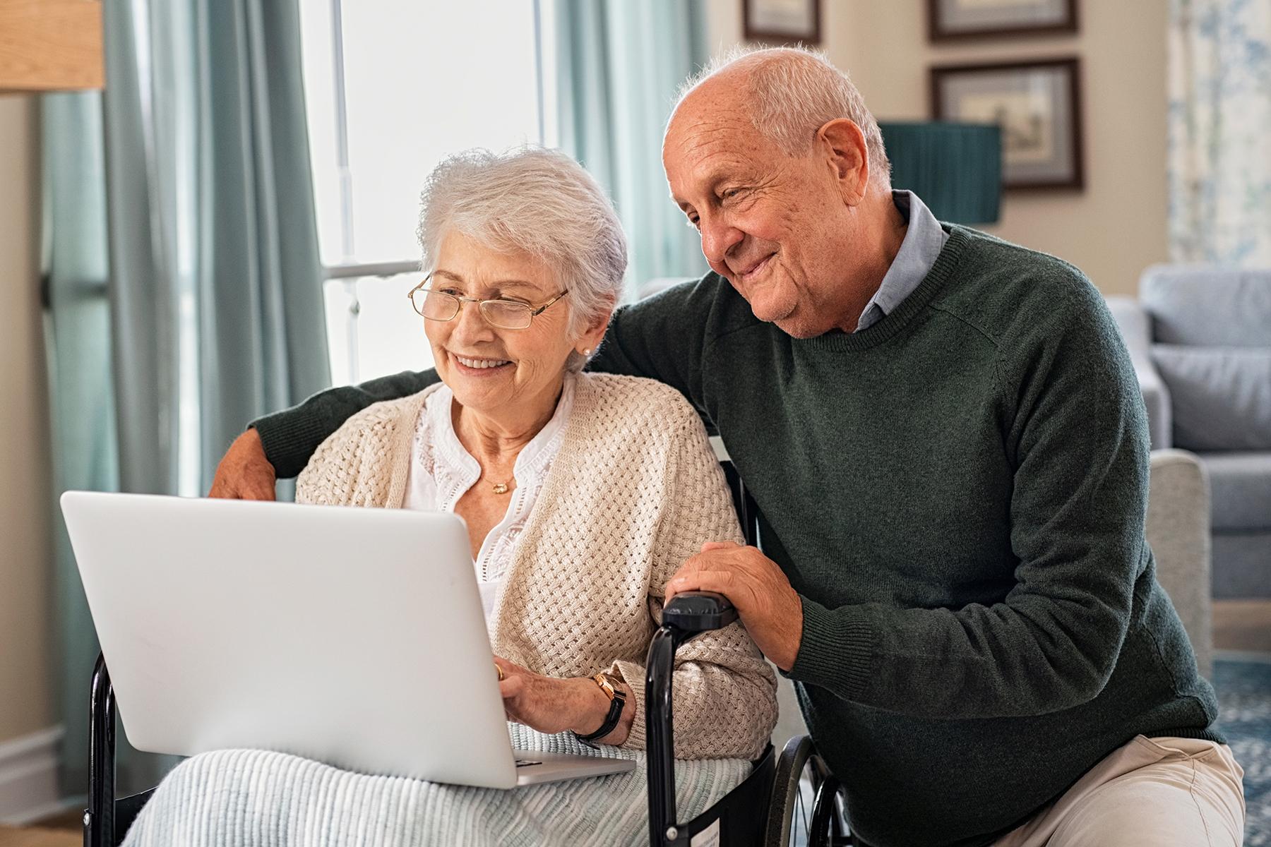elderly-couple-using-laptop